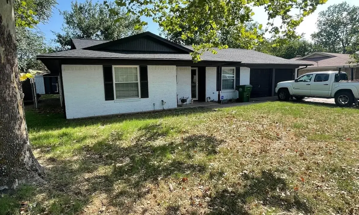 Professional roofing crew working on a residential roof in Mayfield Heights